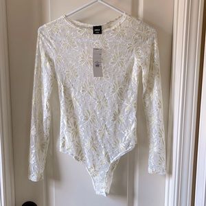 Body suit by aria clothing.